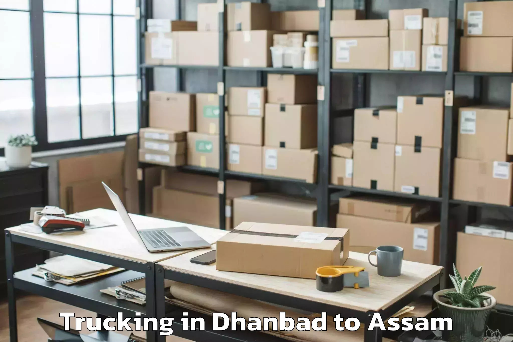 Book Dhanbad to Soalkuchi Trucking